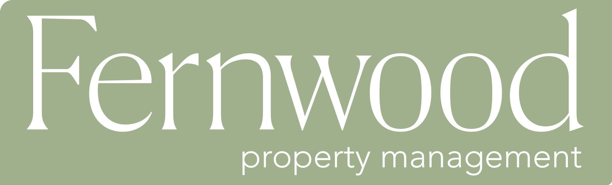 A green sign with the word Fernwood in white.